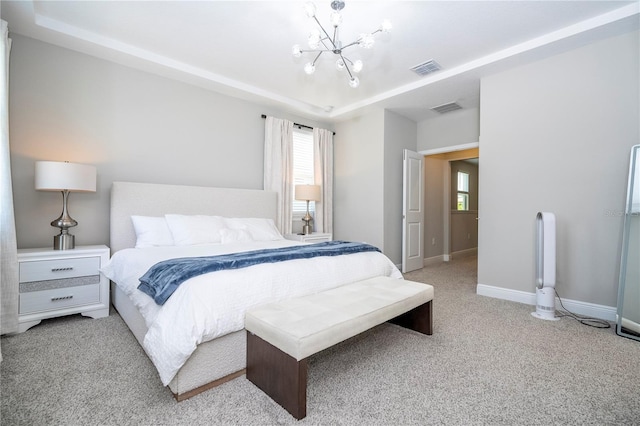 12259 Bracco St, Winter Garden, FL 34787 - carpeted bedroom with a chandelier, multiple windows, a tray ceiling, and baseboards
