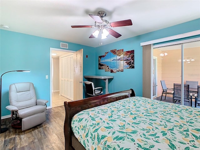8704 Knightsbridge Ct Unit B, Kissimmee, FL 34747 - bedroom with wood finished floors, ceiling fan, and baseboards