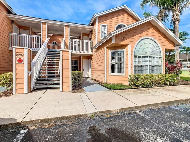 8704 Knightsbridge Ct Unit B, Kissimmee, FL 34747 - view of building exterior featuring stairway