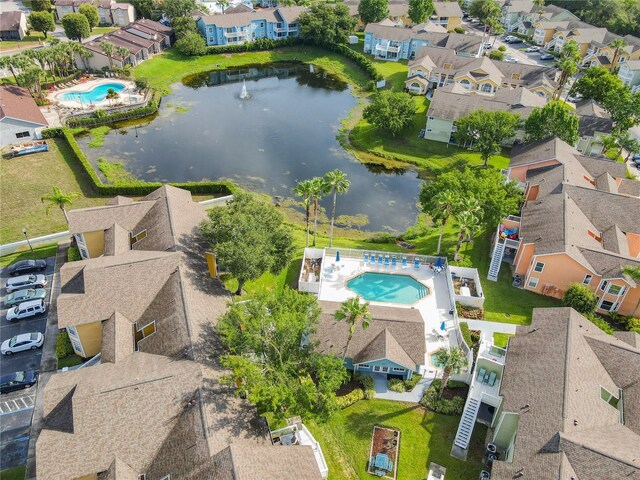 8704 Knightsbridge Ct Unit B, Kissimmee, FL 34747 - aerial perspective of suburban area featuring a pool area and a nearby body of water