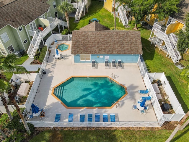 8704 Knightsbridge Ct Unit B, Kissimmee, FL 34747 - community pool featuring stairs and a fenced backyard