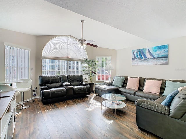 8704 Knightsbridge Ct Unit B, Kissimmee, FL 34747 - living area featuring a ceiling fan, dark wood-type flooring, a textured ceiling, and lofted ceiling