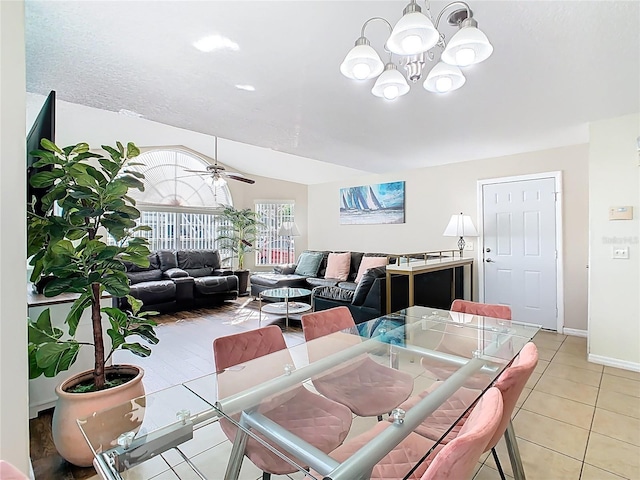 8704 Knightsbridge Ct Unit B, Kissimmee, FL 34747 - dining area with a chandelier, baseboards, light tile patterned flooring, a ceiling fan, and lofted ceiling