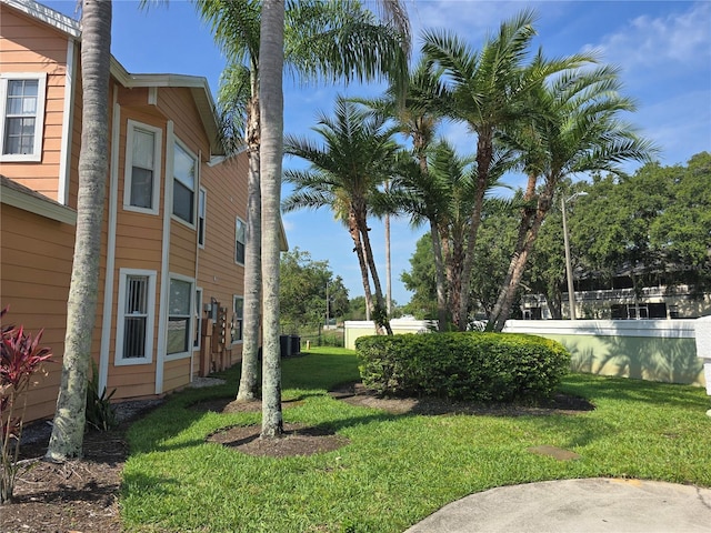 8704 Knightsbridge Ct Unit B, Kissimmee, FL 34747 - view of grassy yard with central air condition unit