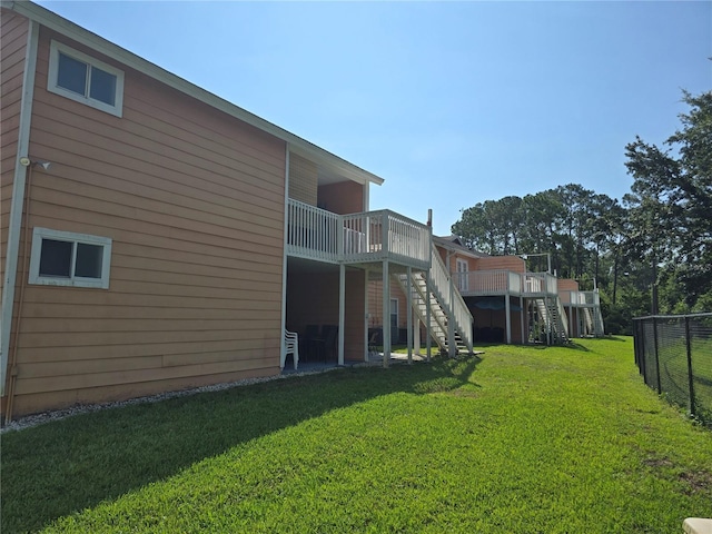 8704 Knightsbridge Ct Unit B, Kissimmee, FL 34747 - view of yard with stairway and a deck