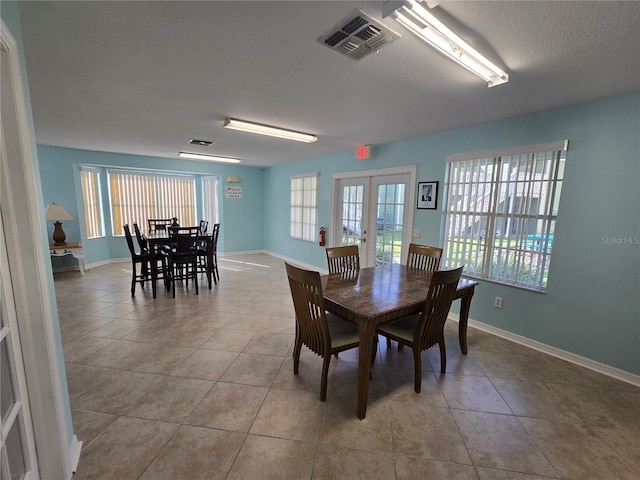 8704 Knightsbridge Ct Unit B, Kissimmee, FL 34747 - dining space with tile patterned flooring, baseboards, and french doors