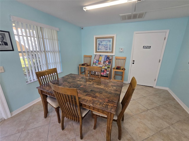 8704 Knightsbridge Ct Unit B, Kissimmee, FL 34747 - dining room with light tile patterned floors and baseboards