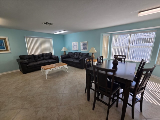 8704 Knightsbridge Ct Unit B, Kissimmee, FL 34747 - dining room featuring tile patterned flooring and baseboards