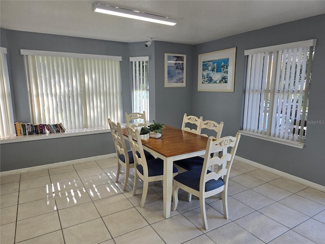 8704 Knightsbridge Ct Unit B, Kissimmee, FL 34747 - tiled dining room featuring baseboards