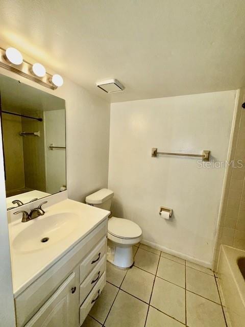 5269 Vineland Rd Unit 101, Orlando, FL 32811 - bathroom featuring vanity, tile patterned flooring, and toilet