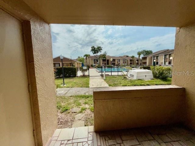 5269 Vineland Rd Unit 101, Orlando, FL 32811 - balcony featuring view of pool and a residential view