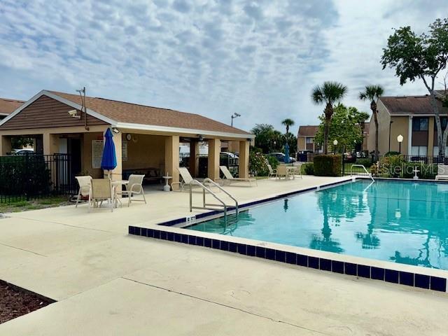 5269 Vineland Rd Unit 101, Orlando, FL 32811 - community pool with a patio
