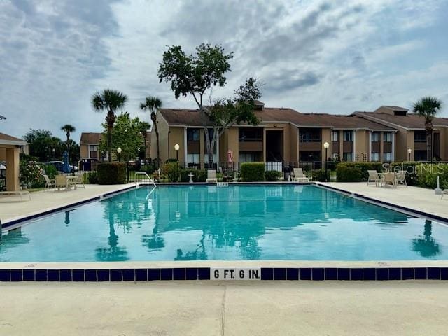 5269 Vineland Rd Unit 101, Orlando, FL 32811 - community pool featuring a patio