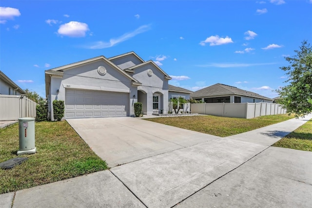 1821 Benevento St, Saint Cloud, FL 34771 - view of front of property featuring a garage, driveway, and stucco siding