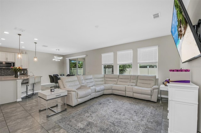 1821 Benevento St, Saint Cloud, FL 34771 - living room with recessed lighting, light tile patterned floors, and baseboards
