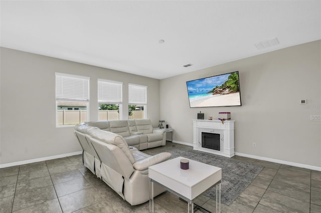 1821 Benevento St, Saint Cloud, FL 34771 - living area with baseboards and a glass covered fireplace