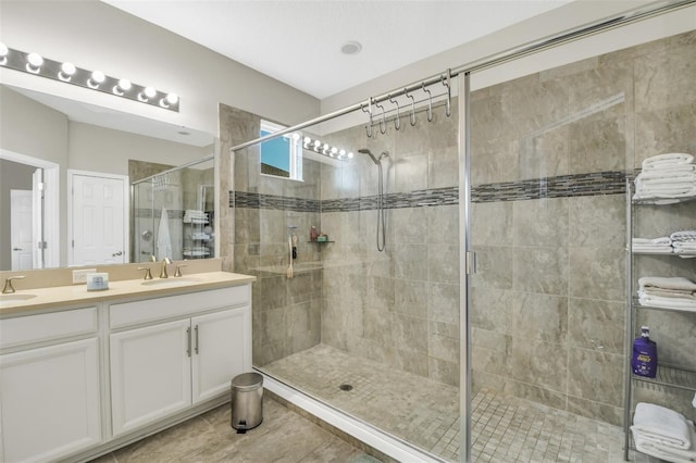 1821 Benevento St, Saint Cloud, FL 34771 - bathroom featuring double vanity, tiled shower, and tile patterned flooring