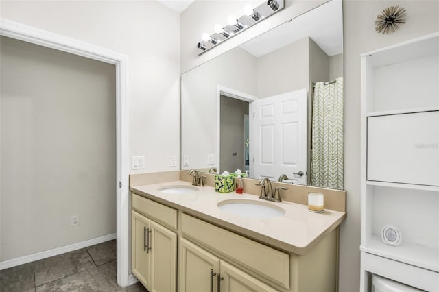 1821 Benevento St, Saint Cloud, FL 34771 - bathroom featuring double vanity, tile patterned flooring, and baseboards