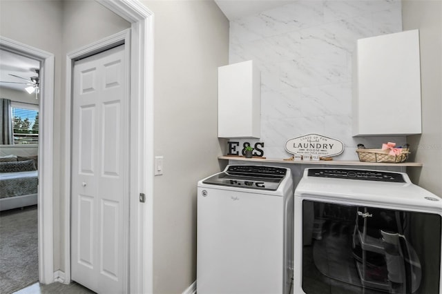 1821 Benevento St, Saint Cloud, FL 34771 - laundry room with washing machine and dryer, a ceiling fan, baseboards, and cabinet space