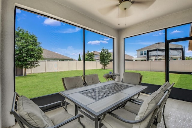 1821 Benevento St, Saint Cloud, FL 34771 - sunroom / solarium with ceiling fan and outdoor dining space