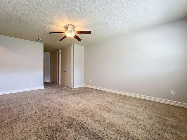 7679 Bent Bow Trl, Winter Park, FL 32792 - unfurnished room with ceiling fan, a textured ceiling, baseboards, and carpet