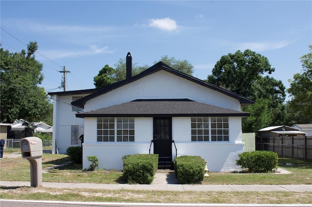 161 Bolender Rd, Auburndale, FL 33823 - bungalow-style house with stucco siding and a shingled roof