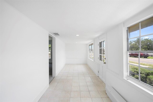 161 Bolender Rd, Auburndale, FL 33823 - hallway featuring healthy amount of natural light, light tile patterned flooring, recessed lighting, and baseboards