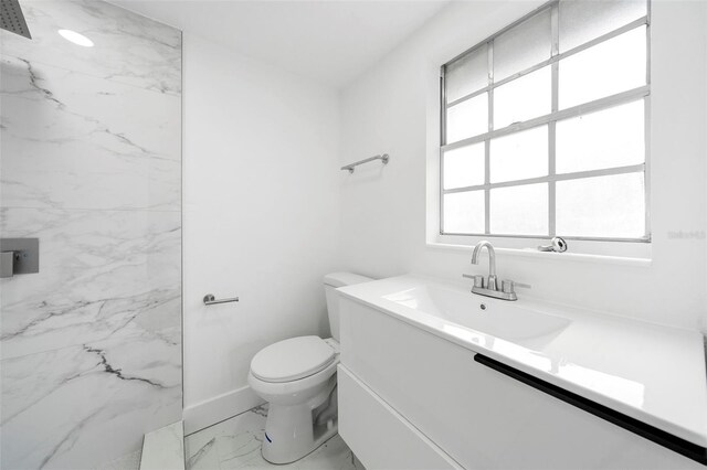 161 Bolender Rd, Auburndale, FL 33823 - bathroom with marble finish floors, toilet, baseboards, and vanity