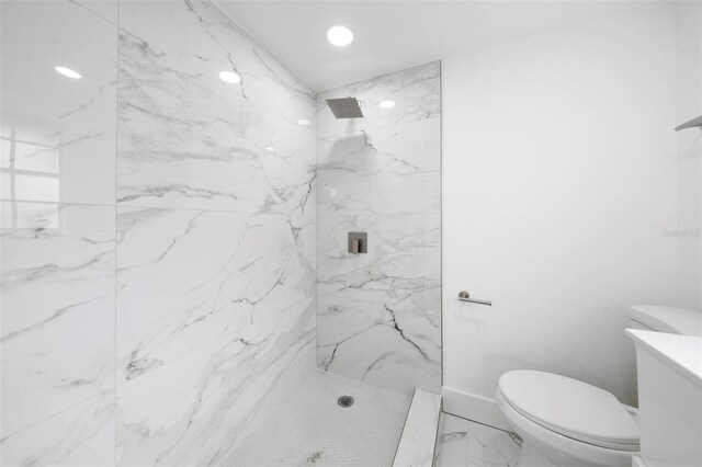 161 Bolender Rd, Auburndale, FL 33823 - bathroom featuring marble look tile flooring, a marble finish shower, toilet, and recessed lighting