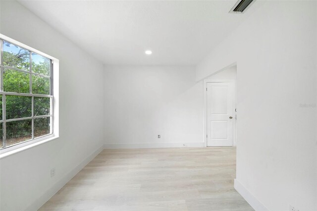 161 Bolender Rd, Auburndale, FL 33823 - empty room featuring baseboards, light wood finished floors, and recessed lighting