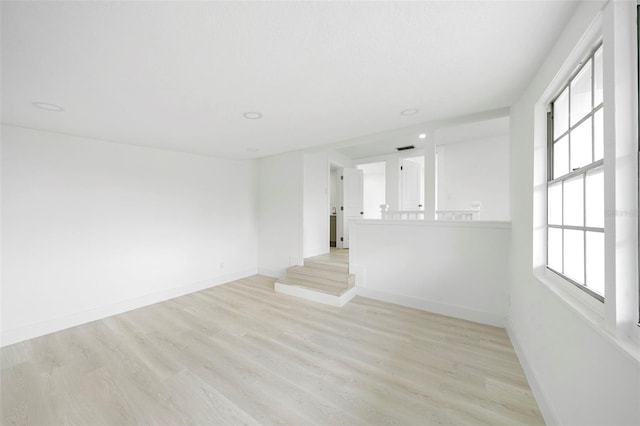 161 Bolender Rd, Auburndale, FL 33823 - empty room featuring healthy amount of natural light, light wood-type flooring, baseboards, and recessed lighting