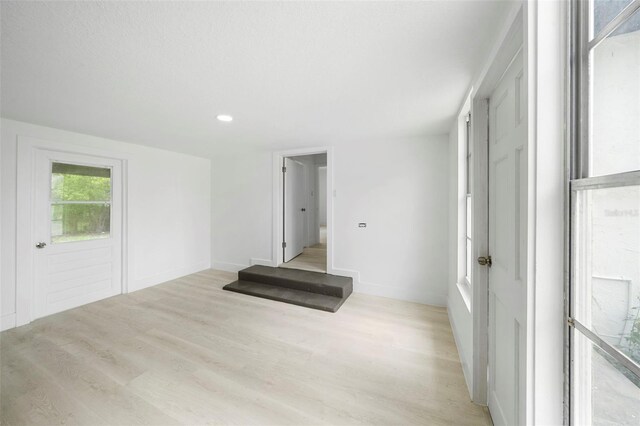 161 Bolender Rd, Auburndale, FL 33823 - spare room featuring light wood-style floors, baseboards, and recessed lighting