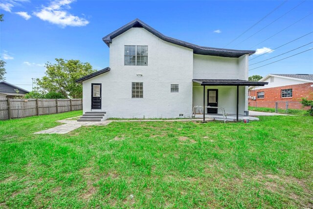 161 Bolender Rd, Auburndale, FL 33823 - rear view of property with stucco siding