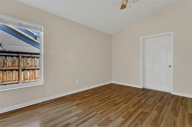 3014 Linmont Ln, Eustis, FL 32726 - unfurnished room featuring wood finished floors, vaulted ceiling, a ceiling fan, and baseboards