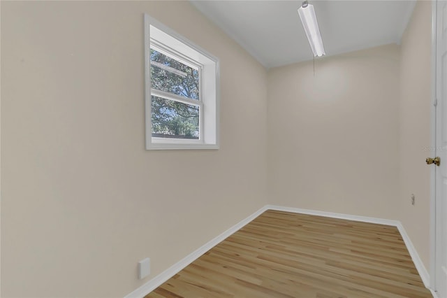 3014 Linmont Ln, Eustis, FL 32726 - empty room with light wood-type flooring, baseboards, and attic access