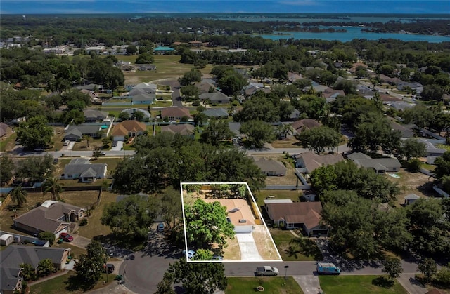 3014 Linmont Ln, Eustis, FL 32726 - aerial perspective of suburban area featuring property parcel outlined and a large body of water