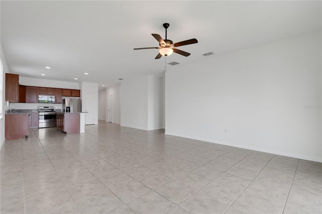 3953 Baja Dr, Saint Cloud, FL 34772 - unfurnished living room with recessed lighting, a ceiling fan, light tile patterned floors, and a sink
