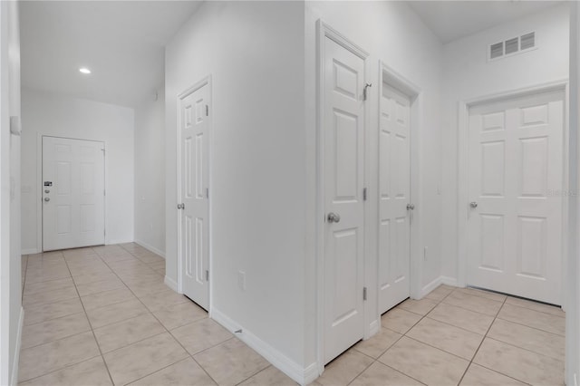 3953 Baja Dr, Saint Cloud, FL 34772 - hallway featuring light tile patterned floors, recessed lighting, and baseboards