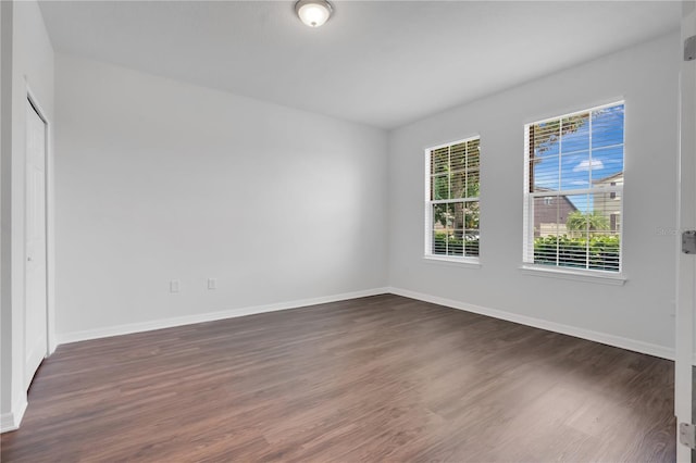 3953 Baja Dr, Saint Cloud, FL 34772 - empty room featuring dark wood-style flooring and baseboards
