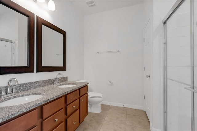 3953 Baja Dr, Saint Cloud, FL 34772 - bathroom featuring double vanity, toilet, and a tile shower