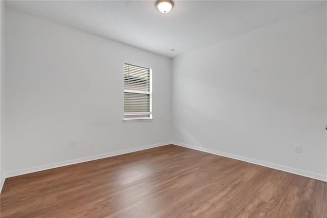 3953 Baja Dr, Saint Cloud, FL 34772 - unfurnished room featuring wood finished floors and baseboards