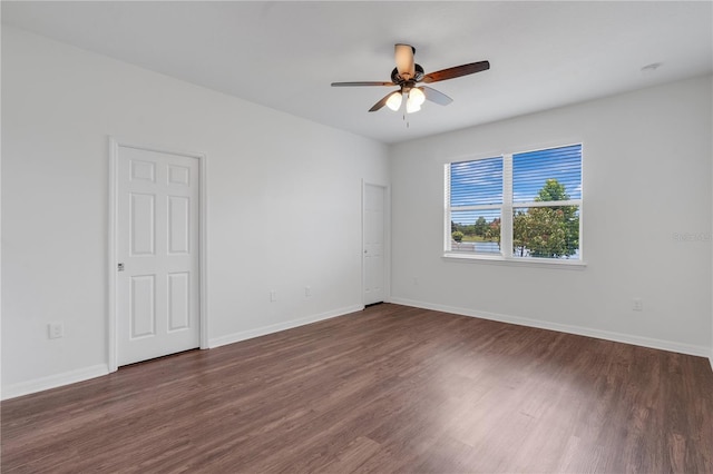 3953 Baja Dr, Saint Cloud, FL 34772 - spare room featuring ceiling fan, dark wood-style flooring, and baseboards