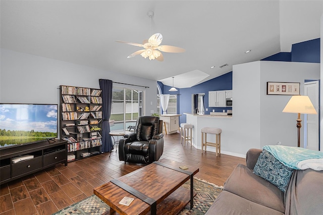 2203 Essex Dr, Ocoee, FL 34761 - living room featuring lofted ceiling, a ceiling fan, dark wood-style flooring, recessed lighting, and baseboards