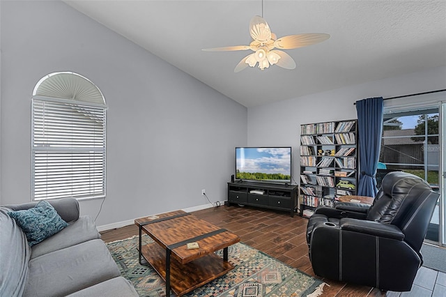 2203 Essex Dr, Ocoee, FL 34761 - living area featuring vaulted ceiling, a ceiling fan, wood finished floors, and baseboards