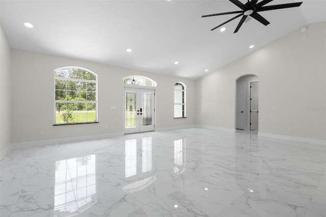 13619 SW 78th Pl, Dunnellon, FL 34432 - spare room with arched walkways, ceiling fan, recessed lighting, marble tiled floors, and french doors