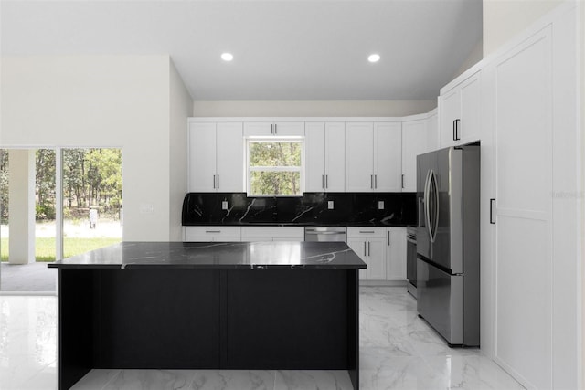 13619 SW 78th Pl, Dunnellon, FL 34432 - kitchen with stainless steel appliances, light marble finish flooring, decorative backsplash, a center island, and recessed lighting