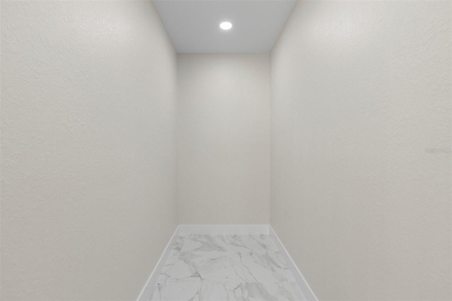 13619 SW 78th Pl, Dunnellon, FL 34432 - interior space with marble look tiles and recessed lighting