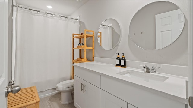 5291 Meredrew Ln, Saint Cloud, FL 34771 - bathroom featuring vanity, toilet, shower / bath combo with shower curtain, and recessed lighting