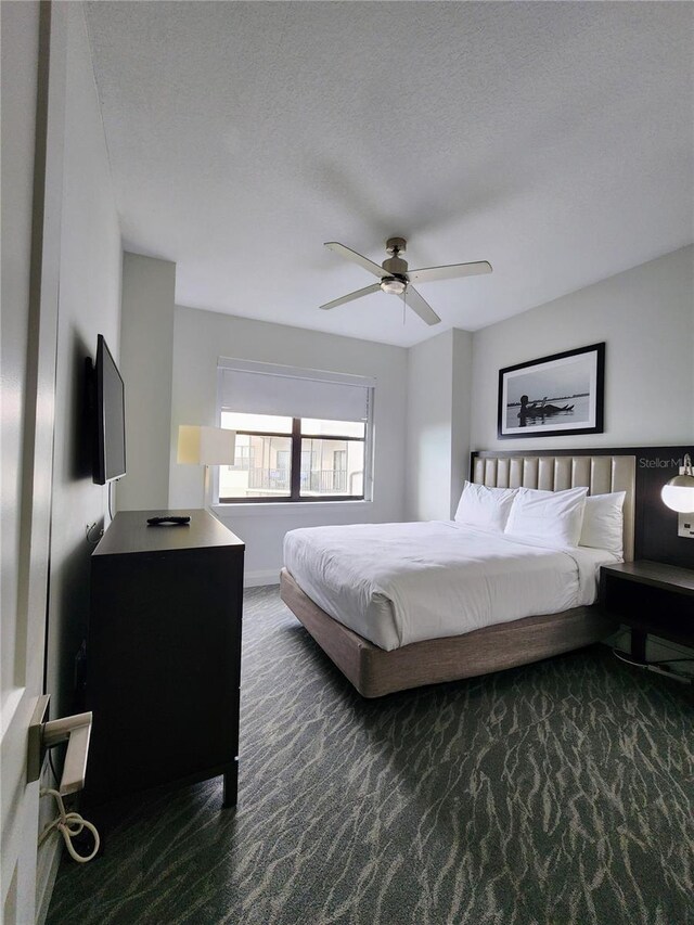 14501 Grove Resort Ave Unit 3737, Winter Garden, FL 34787 - bedroom featuring carpet floors, a ceiling fan, and a textured ceiling