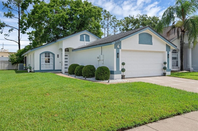 5729 Norman H Cutson Dr, Orlando, FL 32821 - ranch-style house featuring a garage, stucco siding, driveway, and a front lawn